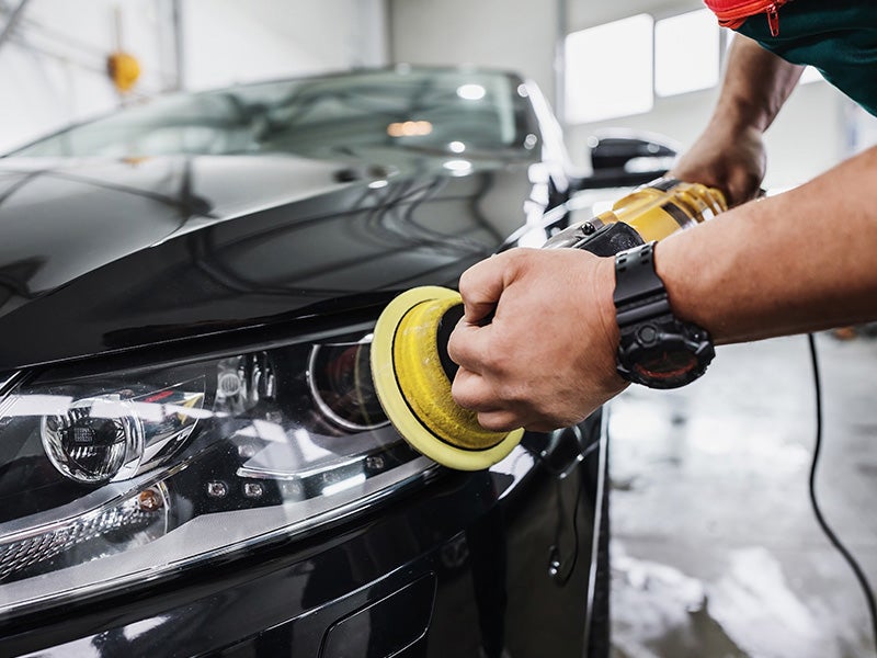 Faulkner Hyundai Harrisburg in Harrisburg PA technician buffing out a newly fixed car