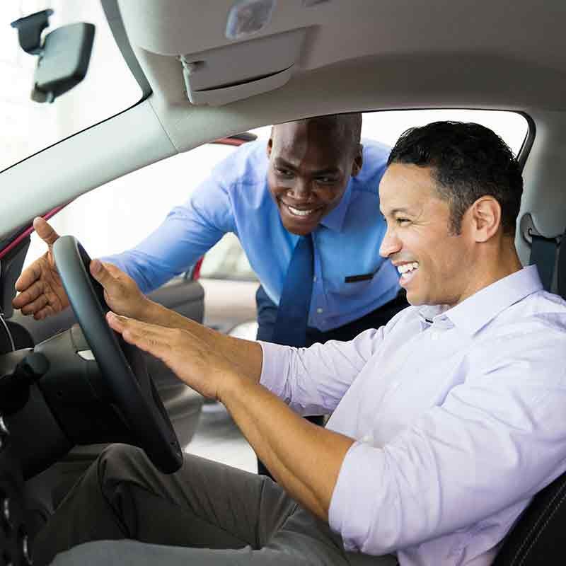 man sitting in a Hyundai vehicle in the showroom of Faulkner Hyundai Harrisburg in Harrisburg PA 